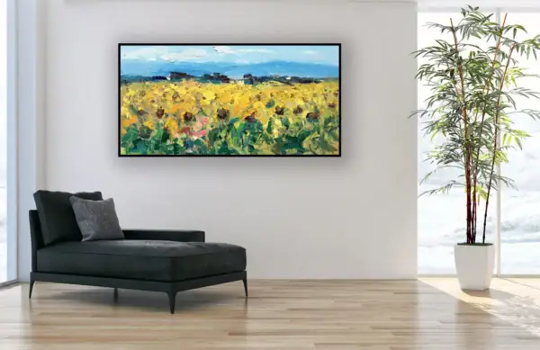 A large horizontal sunflower painting by Agostino Veroni used as a focal point in a minimalist room above a black chaise longue.