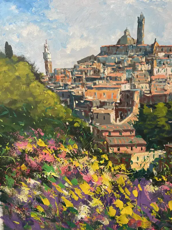Detailed macro shot highlighting the contrast between the stone city buildings on the hill and the vibrant, textured wildflower field in the foreground.
