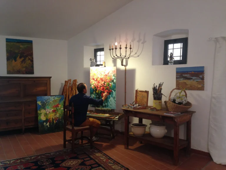 Artist Agostino Veroni painting en plein air in his 17th-century independent studio at Villa Minghetti, Tuscany.