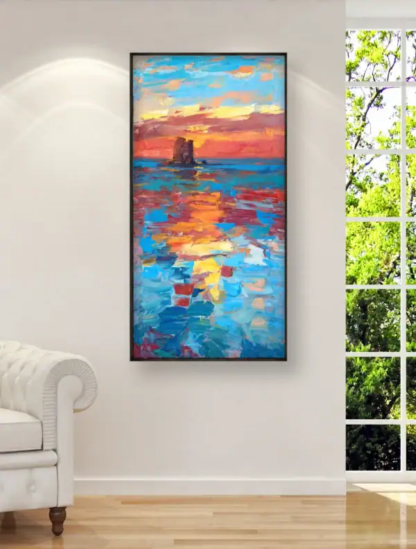 Vertical sunset seascape oil painting displayed as luxury home decor on a bright living room wall next to a window.
