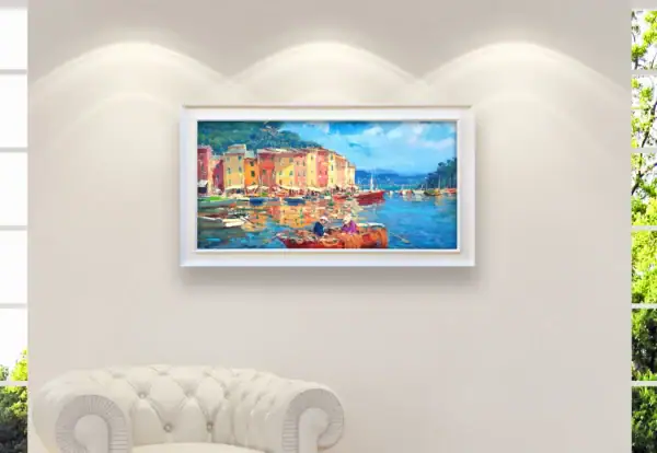 Large panoramic original Portofino oil painting displayed as luxury home decor on a bright living room wall above a white chesterfield sofa.