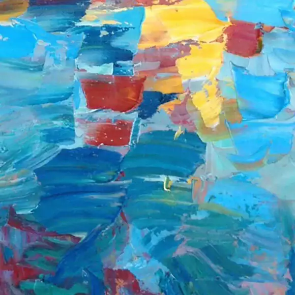 Macro view of thick blue and turquoise premium oil paint layers showing rich palette knife texture in the foreground.