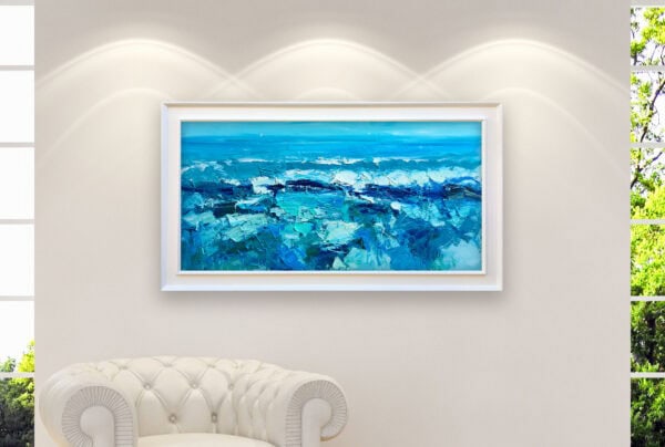 A modern impressionist ocean waves oil painting displayed in a white frame on a living room wall above a classic sofa.