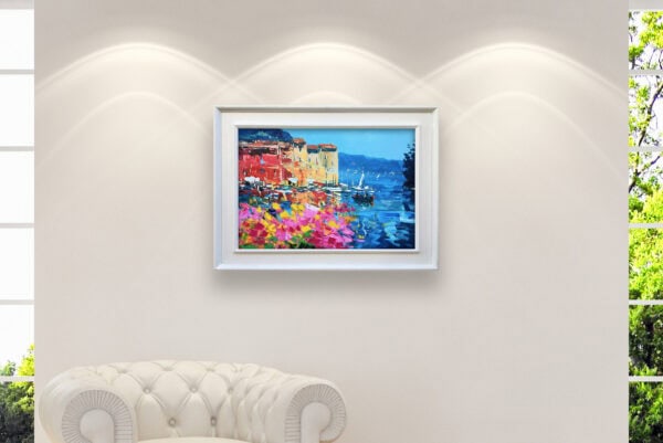 Original Portofino oil painting with white frame hanging on a wall above a sofa in a modern room setup.