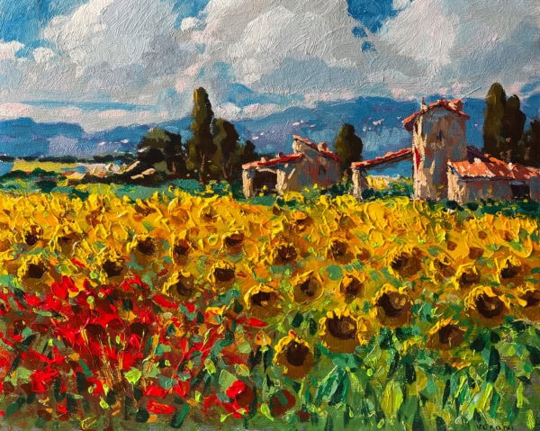 This Tuscany oil painting features a blooming field of yellow sunflowers and red poppies under a summer sky. Full view of the original impressionist canvas artwork painted with a heavy impasto palette knife technique. In the background, rustic stone farmhouses nestled among green trees and rolling blue Italian hills add charm and depth to the landscape.