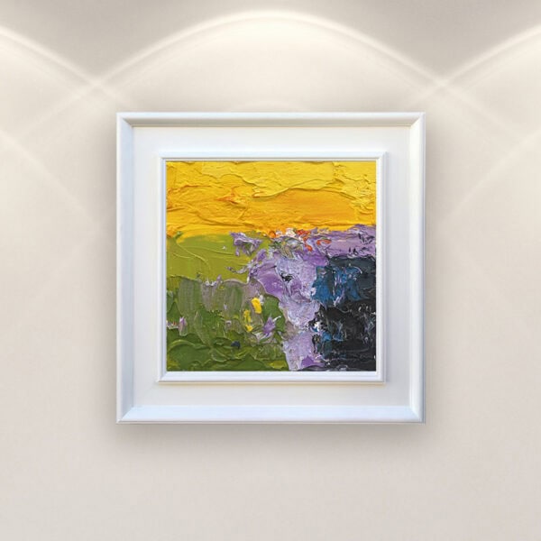 Abstract oil painting on canvas by Agostino Veroni, framed in white. Modern impasto landscape with yellow, green, and purple palette knife textures, mounted on a light wall.