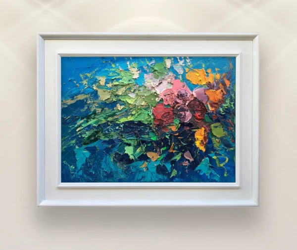 Framed roses oil painting on canvas by Veroni. Original impressionist floral art in white frame on gallery wall, showing heavy palette knife impasto in red, pink, green, and blue.(