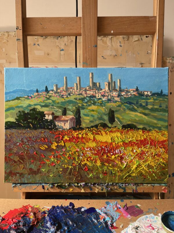 Original San Gimignano oil painting on easel, featuring a textured Tuscan landscape with poppy fields by Agostino Veroni.